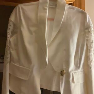 Newport News white Jean Jacket with Lace on the sleeves.